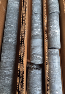 A box of rock core - green shale.